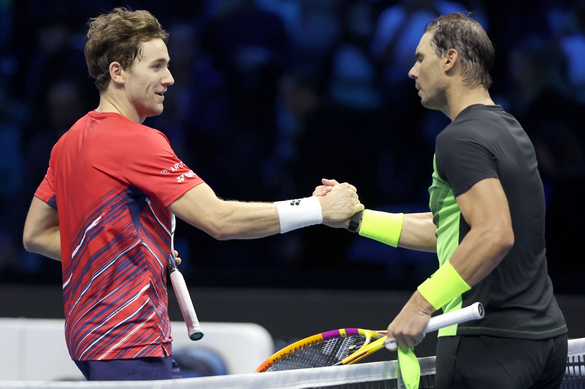 Casper Ruud greets Rafael Nadal.